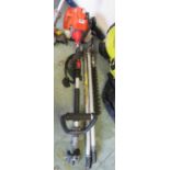 Orange petrol powered multi tool with hedge cutter attachment