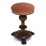 A mid-19th century rosewood adjustable piano stool on claw feet