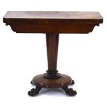 A mid-19th century rosewood card table, the fold-over top on a graduated column and four claw