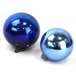 Two late 19th/early 20th century 'witch balls' with blue mirrored exteriors, d. approx. 20 cm and 15