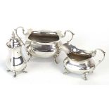 A silver bachelors two handled sugar bowl and matching cream jug, together with a silver pepper,