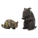 A bronze figure modelled as a seated mouse up on its hind quarters, h. 8 cm, together with another