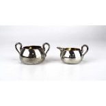 A Victorian miniature silver and parcel gilt two handled sugar bowl and matching cream jug, maker