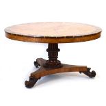 A 19th century centre or loo table, the pollard oak veneers spiralling out from the centre with