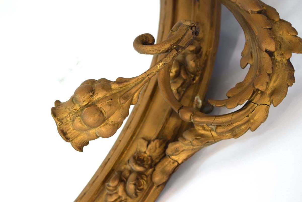 A late 18th/early 19th century giltwood and plaster wall mirror, the oval plate 64 x 50 cm over - Image 4 of 7