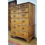 A Georgian walnut and crossbanded chest-on-chest with an arrangement of two small drawers over