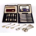 A set of six silver handled butter knives, a set of five silver teaspoons and two silver