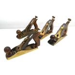 Four GTL brass smoothing planes each with Norris style adjuster