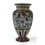 A Doulton Lambeth vase of ovoid form relief decorated with stylised flowers on a beaded blue/treacle