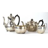 An early 20th century matched silver four piece tea service of gadrooned boat shaped form, C S