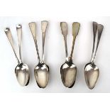 Six Georgian silver old English pattern table spoons and a pair of George IV silver fiddle pattern