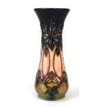 A miniature Moorcroft vase of elongated form, decorated in the 'Cluny' pattern, h. 13 cm