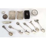 A mixed group of silver comprising two matchbook cases, a medallion, six commemorative teaspoons,