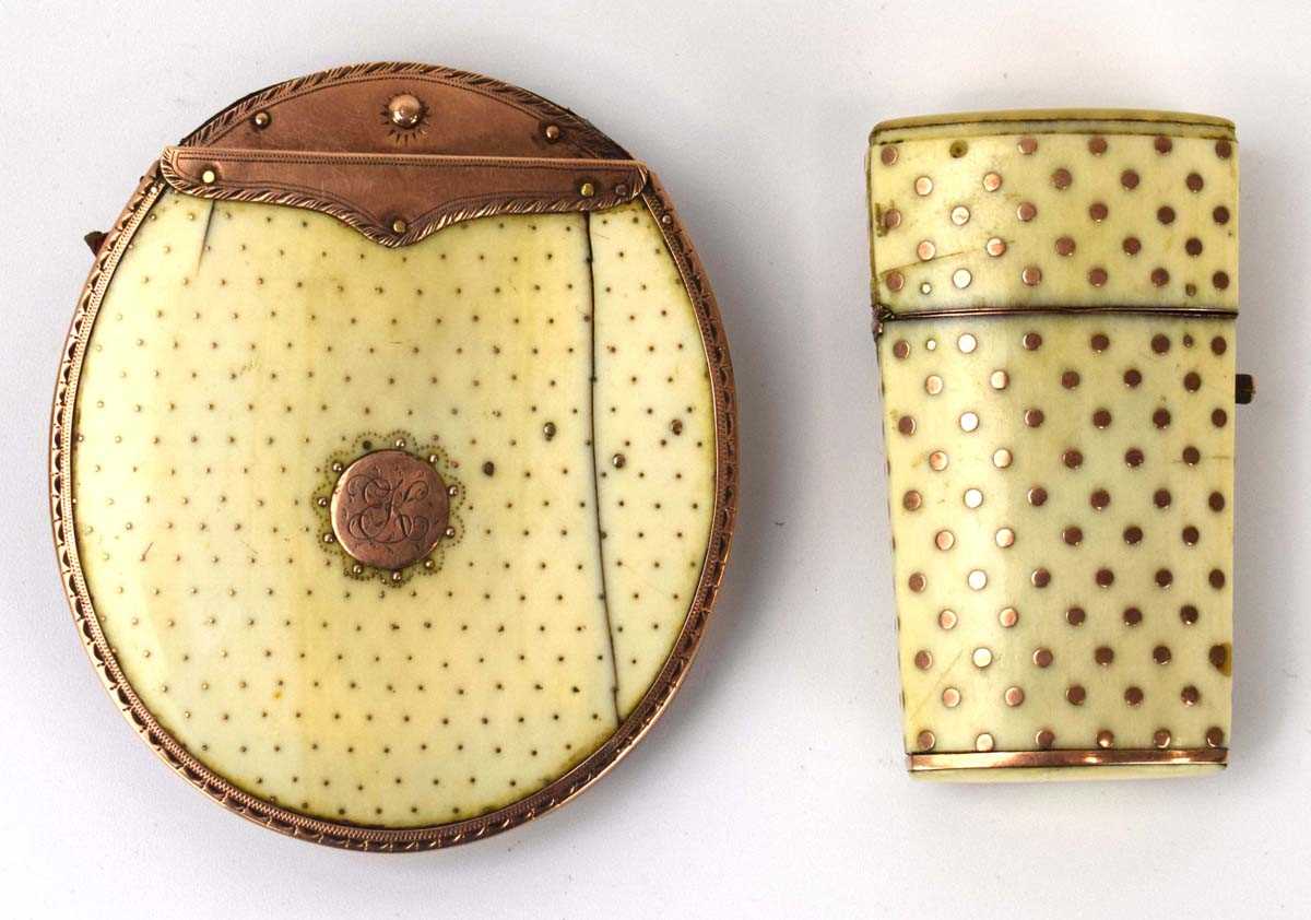 A Victorian purse, the yellow metal mounts supporting two ivory and studded panels together with a