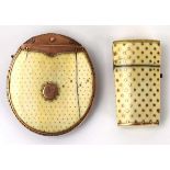 A Victorian purse, the yellow metal mounts supporting two ivory and studded panels together with a