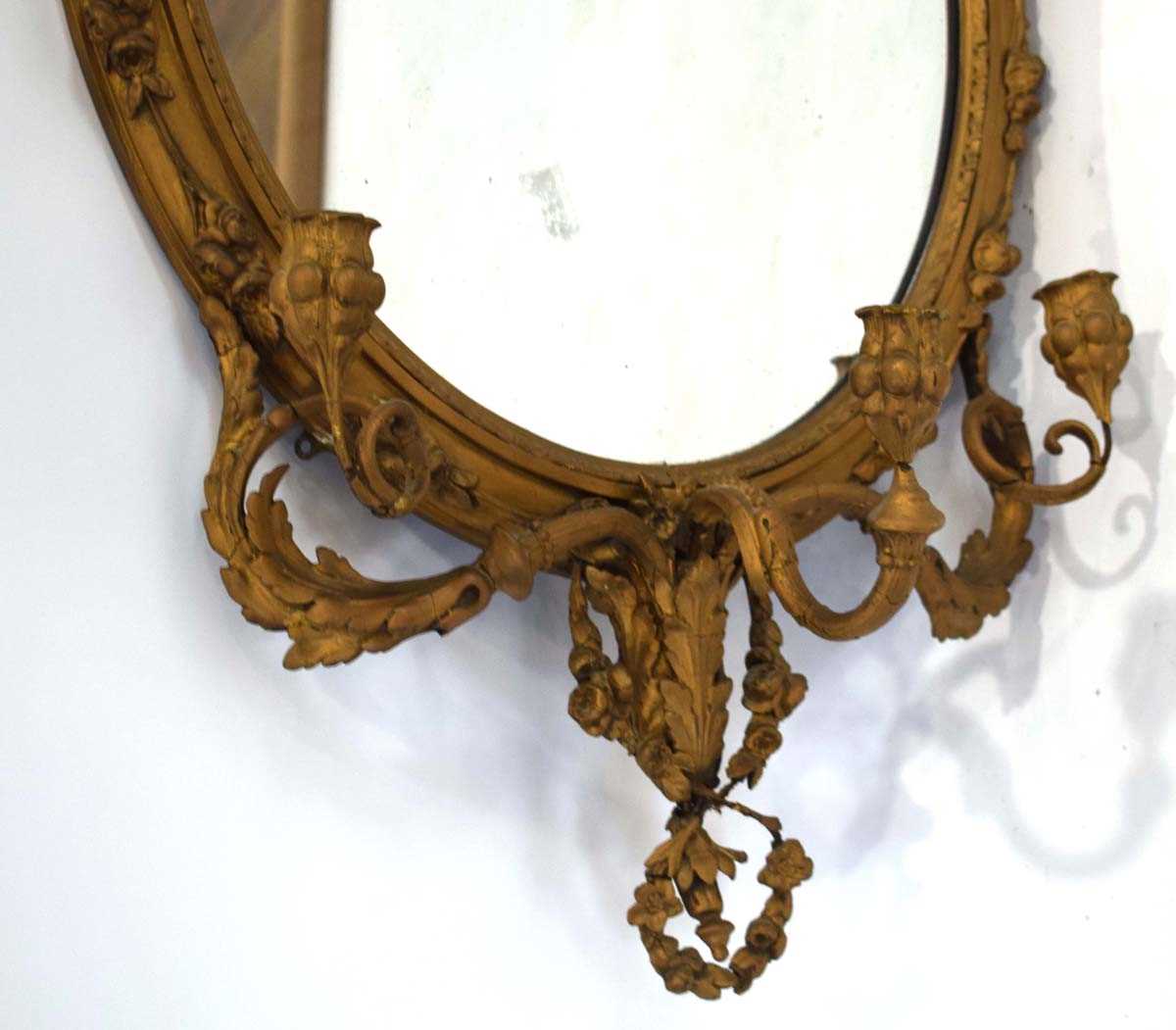A late 18th/early 19th century giltwood and plaster wall mirror, the oval plate 64 x 50 cm over - Image 2 of 7