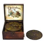 A German tabletop polyphon, Schutz Marke emblem, with a paper label and marquetry box, No. 20098,