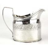 A Georgian III silver milk jug of helmet form, maker (?)SH, London 1809, h. 9 cm, 4.5 ozsCondition