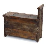 A Provincial oak seat with a single raised handle, lift lid and slab sides, w. 68 cm