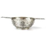 An early 20th century silver two-handled bowl in the form of a quaich with pierced handles and