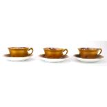 Three pairs of Royal Worcester cabinet tea cups and saucers, each decorated with ripe fruits and