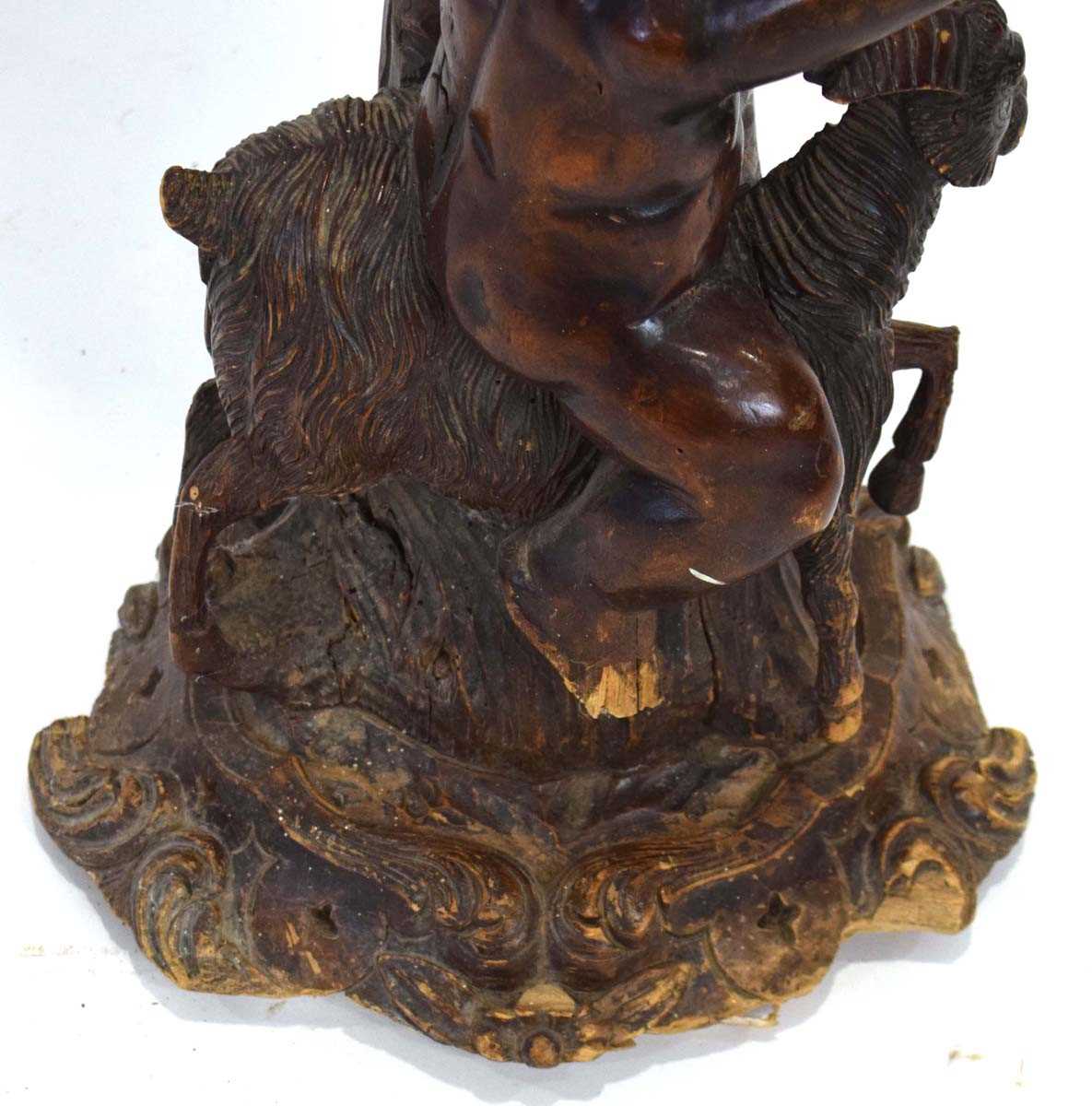 A 19th century and later carved figural torchiere, the column modelled as a cherub riding a - Image 5 of 10