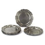A set of six 18th century scalloped pewter trays, d. 18 cm