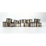 A mixed group of eleven early 20th century and later silver napkin rings, various designs, dates and