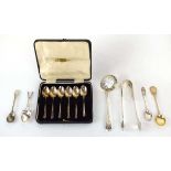 A group of silver comprising a cased set of six teaspoons, a pair of sugar nips, three teaspoons and