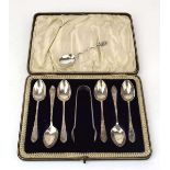 A set of six Edwardian silver florally engraved teaspoons and a pair of matching sugar nips, maker