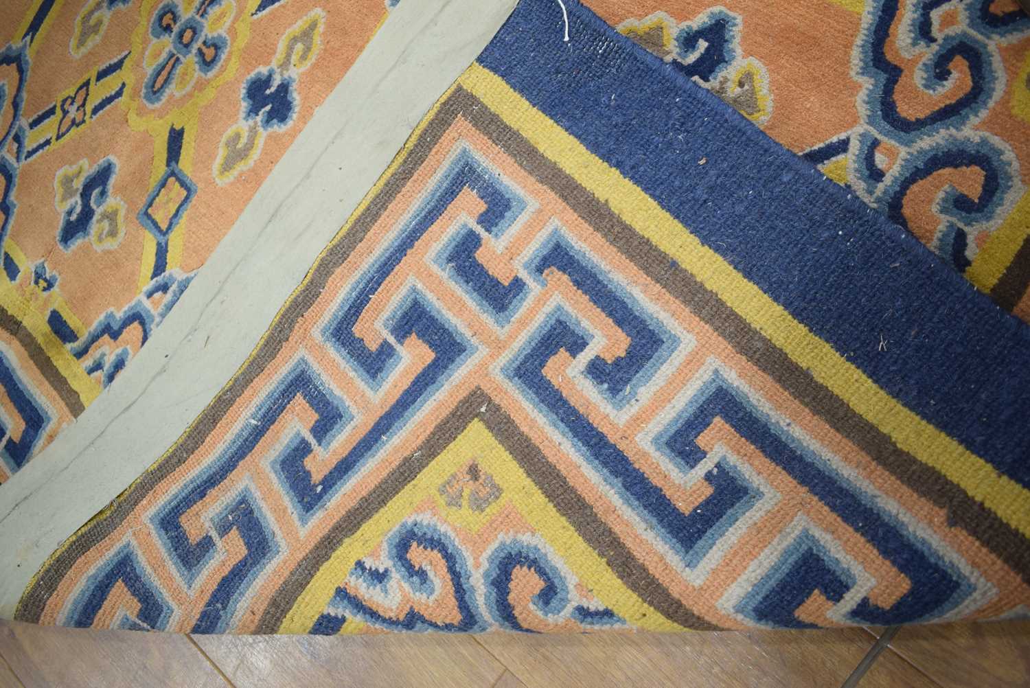 +VAT A 20th century carpet decorated in the Oriental manner with repeated motifs and geometric - Image 4 of 11