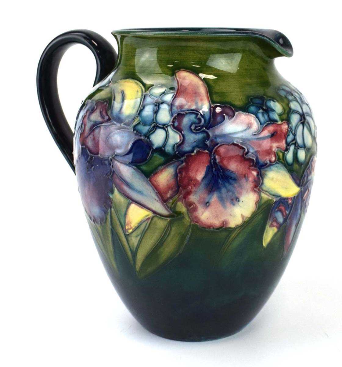 A Moorcroft water jug of ovoid form decorated with stylised flowers on a shaded green ground, h. - Image 2 of 7