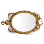 A late 18th/early 19th century giltwood and plaster wall mirror, the oval plate 64 x 50 cm over