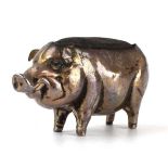 An Edwardian silver pin cushion in the form of a pig, Boots Pure Drug Company, Birmingham 1906, h. 3