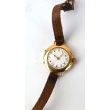 A 15ct yellow gold ladies wristwatch, the circular dial with black/red Arabic numerals on a tan