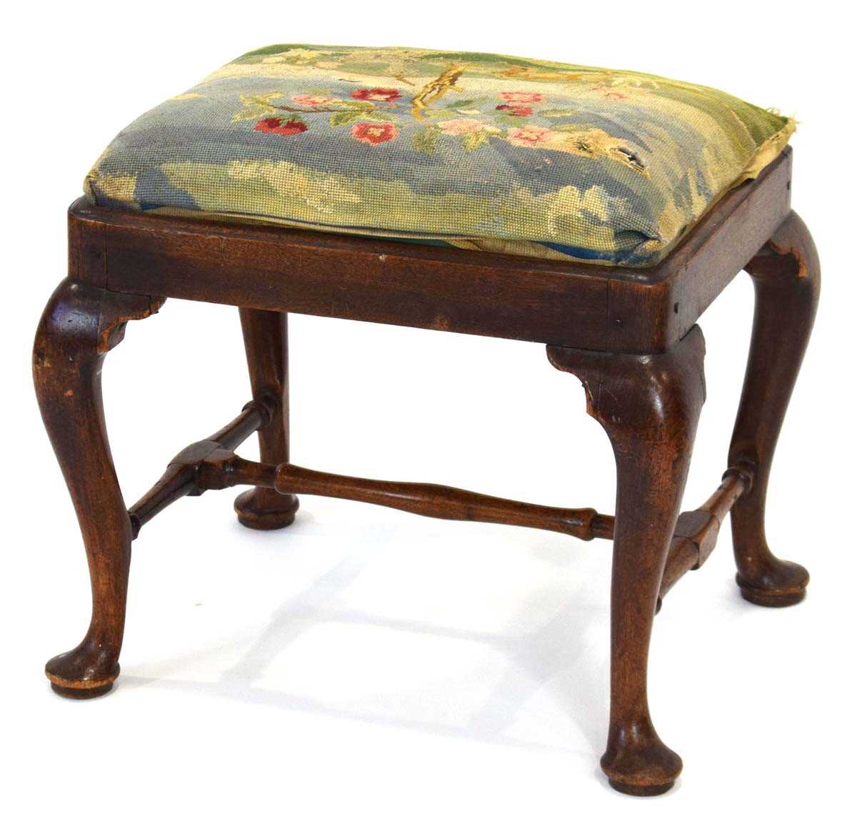 An 18th century and later stool with cabriole legs, an X-stretcher and later embroidered drop-in