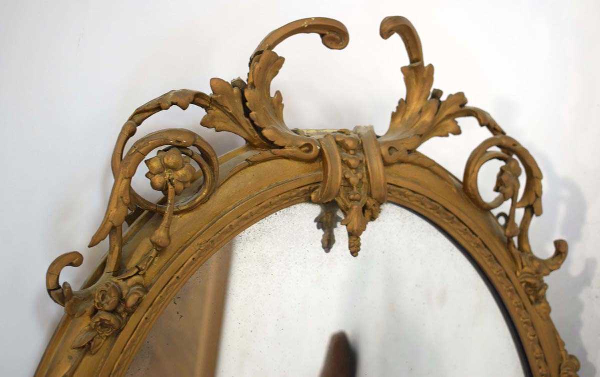 A late 18th/early 19th century giltwood and plaster wall mirror, the oval plate 64 x 50 cm over - Image 5 of 7