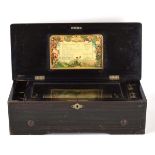 A Swiss cylinder music box, playing on ten airs, bearing a paper label, within a marquetry and