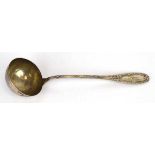 An early 20th century German metalware ladle decorated in the Neo-Classical manner, l. 32 cm, 7 ozs