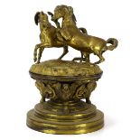 An early 20th century figural group modelled as a pair of horses on a naturalistic setting,