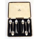 A set of six silver rats tail teaspoons and a pair of matching sugar nips, maker KBs, London 1937,