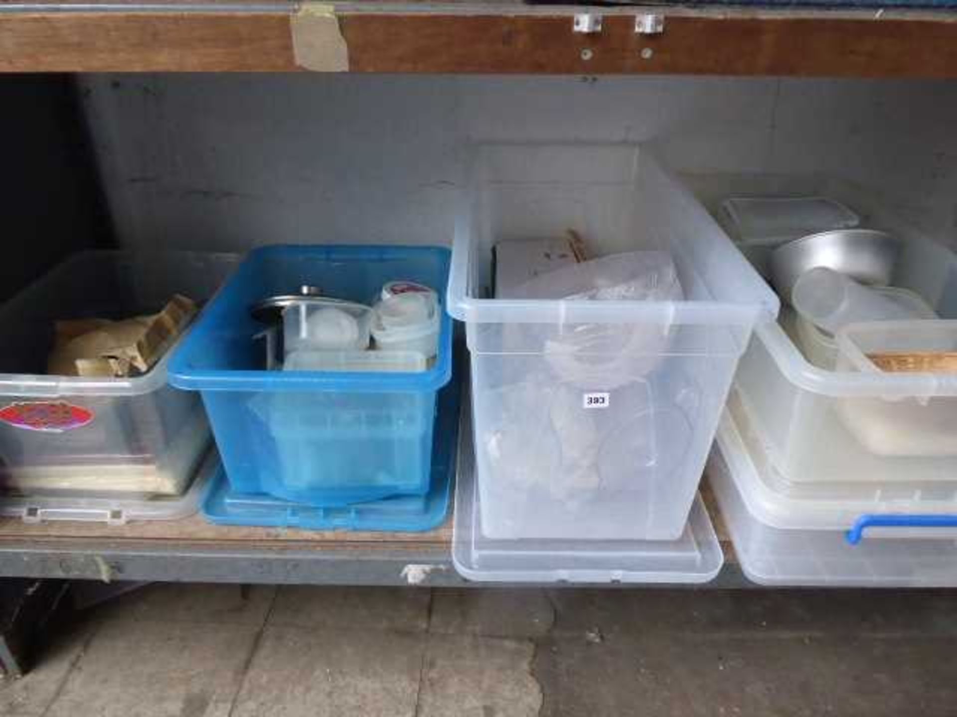 Shelf with 4 boxes of plastic tupperware, plastic jugs, bowls, salts and peppers, etc