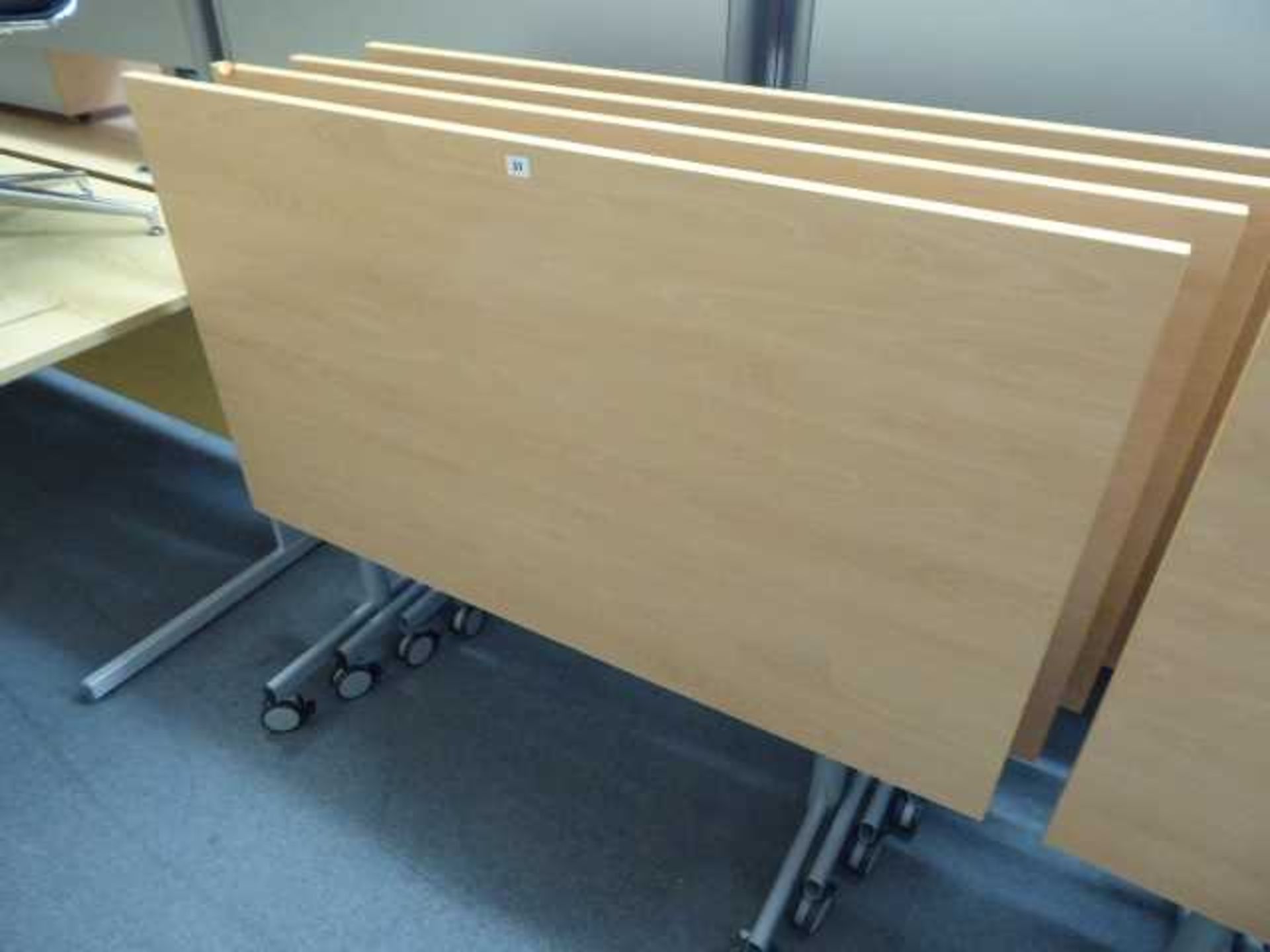 Set of 4 140cm folding top office tables on castors