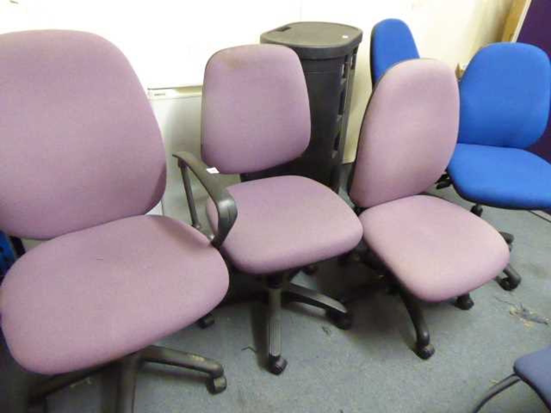 3 purple, 3 blue and 1 dark blue office chairs