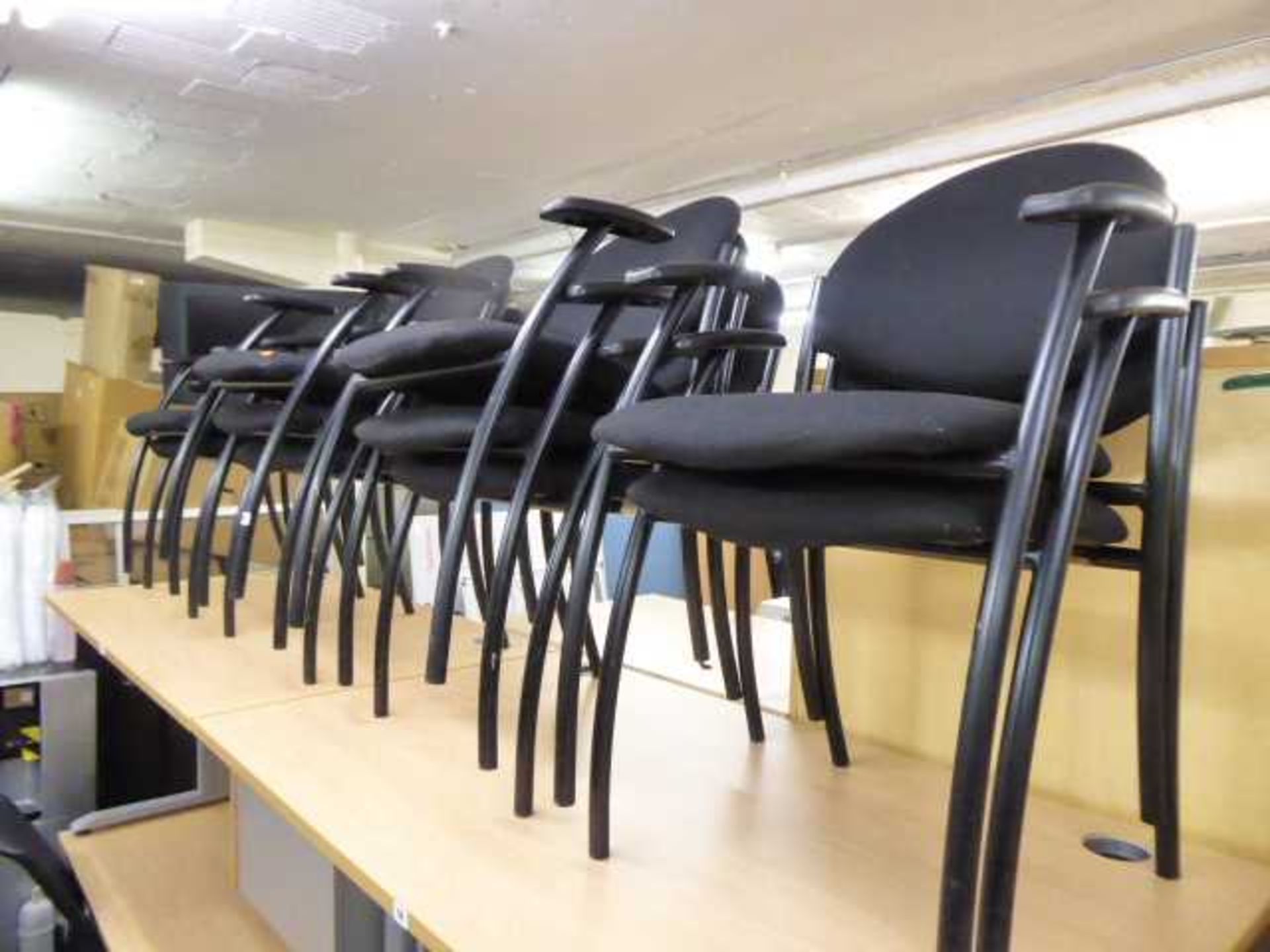 10 black cloth stacking chairs