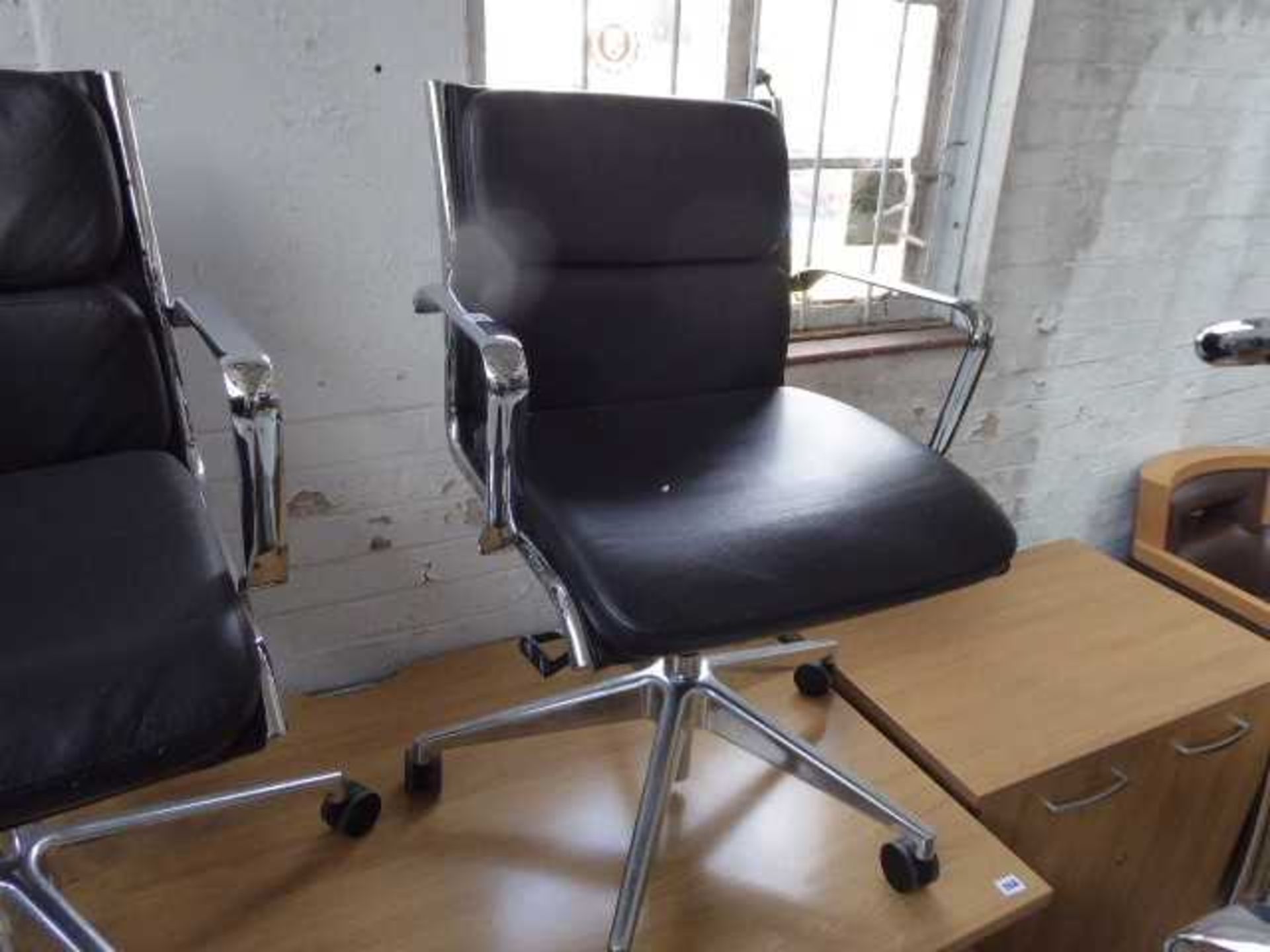Milani Eames style soft pad chair with black upholstery and chrome frame