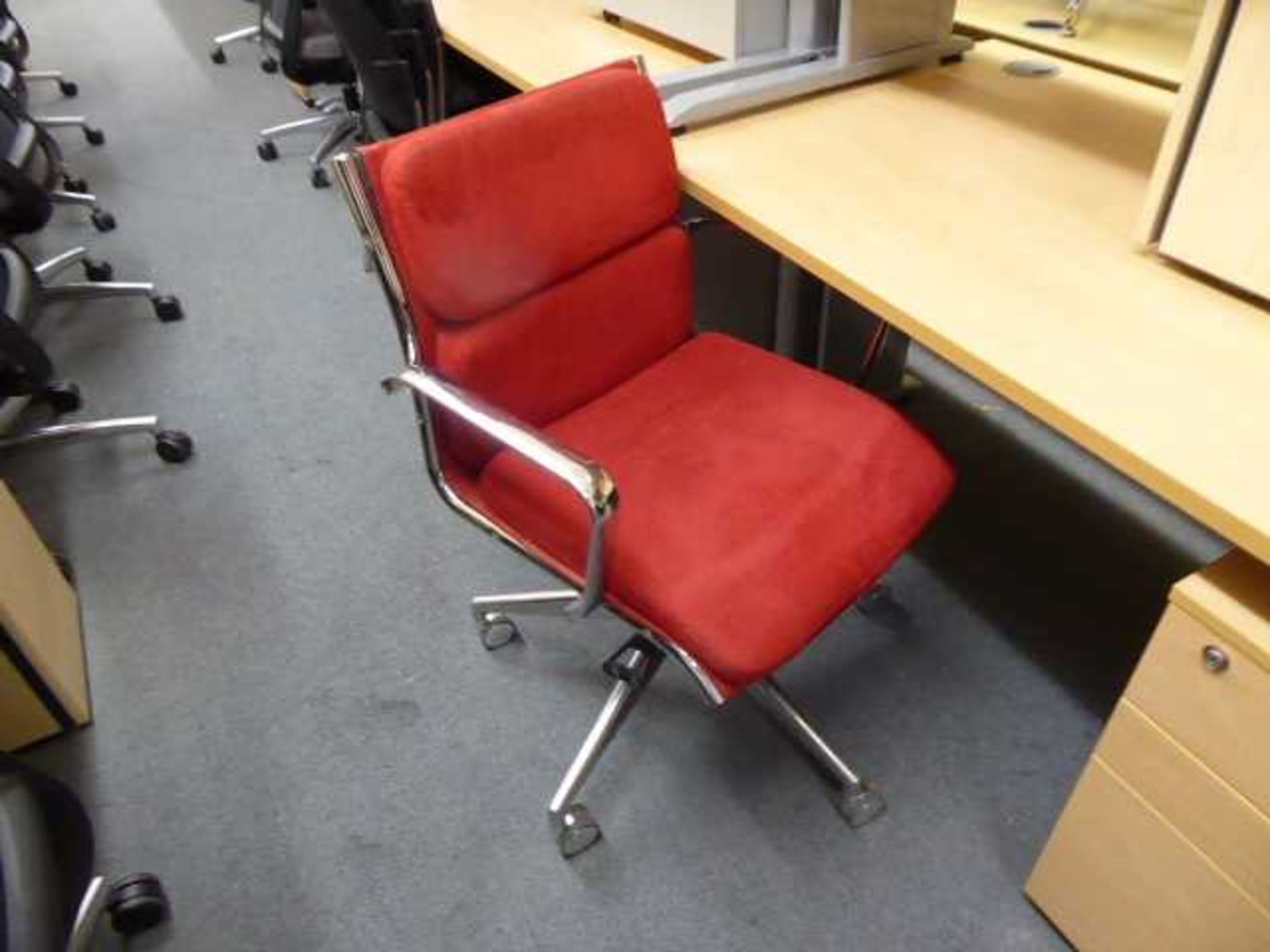 Red velvet Eames style swivel chair