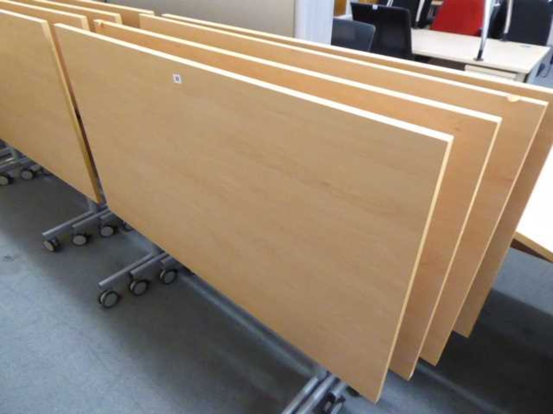 Set of 4 140cm folding top office tables on castors