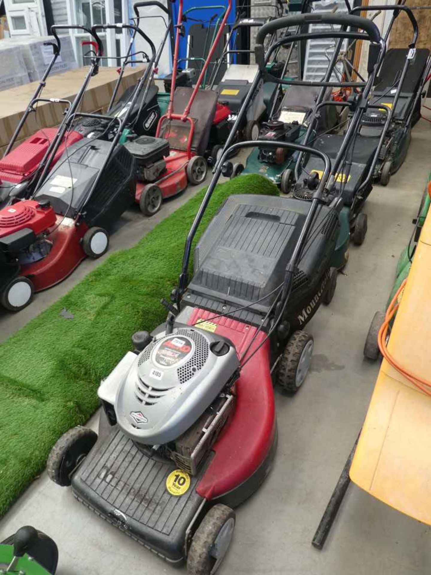 Red alco petrol powered rotary mower with grass box