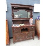 Edwardian mirror backed sideboard with carved panels